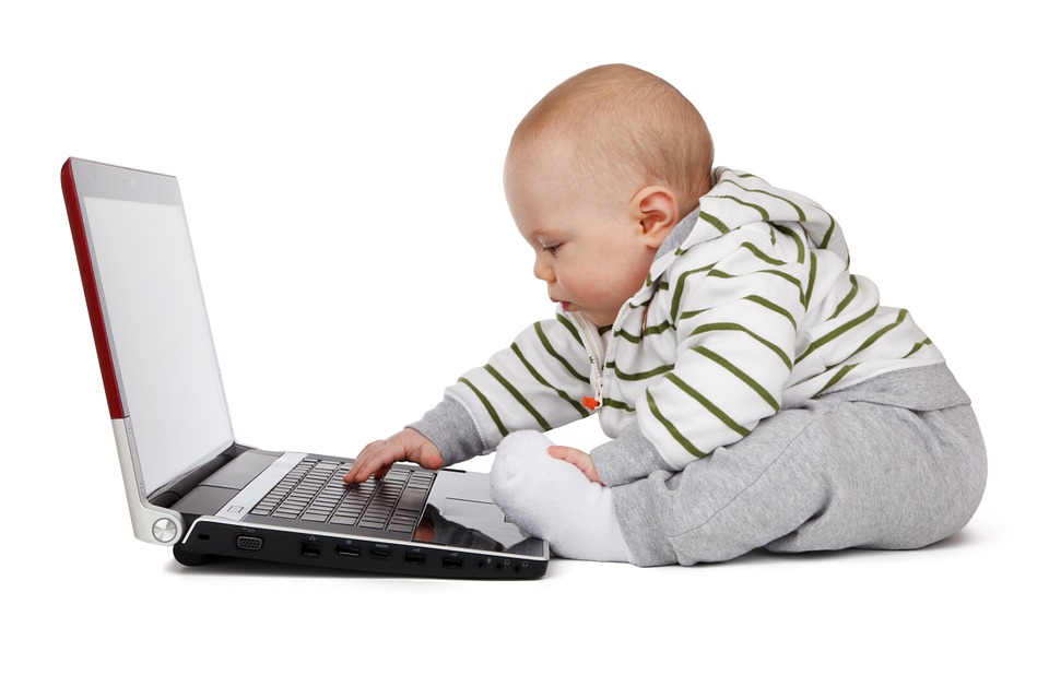 baby on computer Free Range Kids
