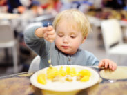 A Mom Is at a Restaurant with Her Screaming Kids. A Stranger Offers to Hold the Baby. A SHOCKING TALE! Cute toddler boy eating potatoes in indoors cafe