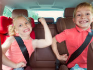 A Mom Stands Firm: It Is Fine to Let Your Kids Wait in the Car During an Errand and I Just Did Happy kids, adorable girl with her brother sitting together in modern car locked with safety belts enjoying family vacation trip on summer weekend