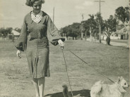 Proto-hipster walks her dog and cat. 