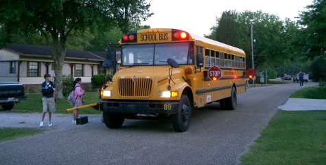 Parents MUST be at the bus stop AND must not leave their other children alone. Hmm. 