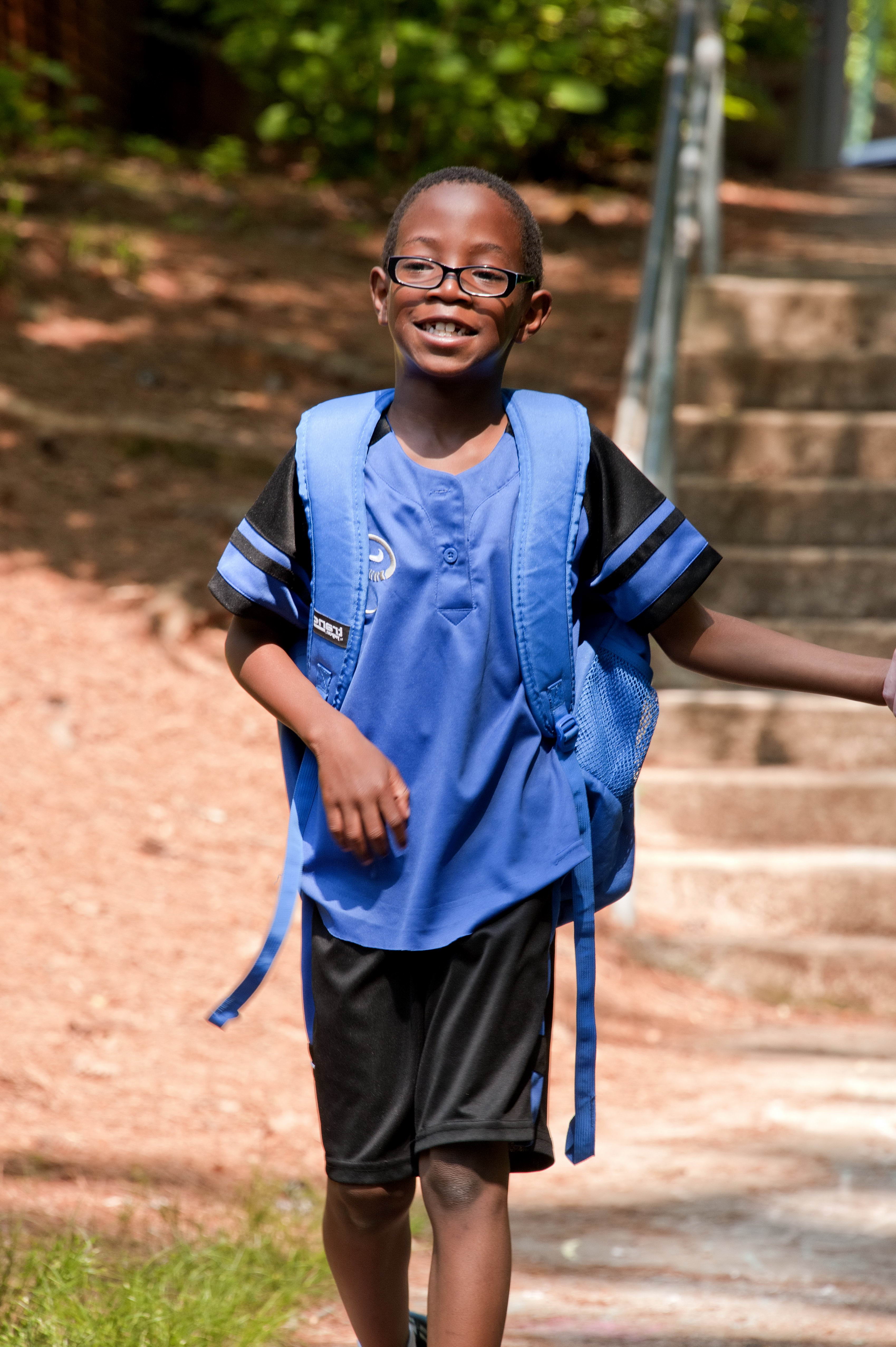 Young african american schoolboy was walking Free Range Kids