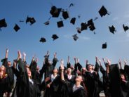 college grad hats in air