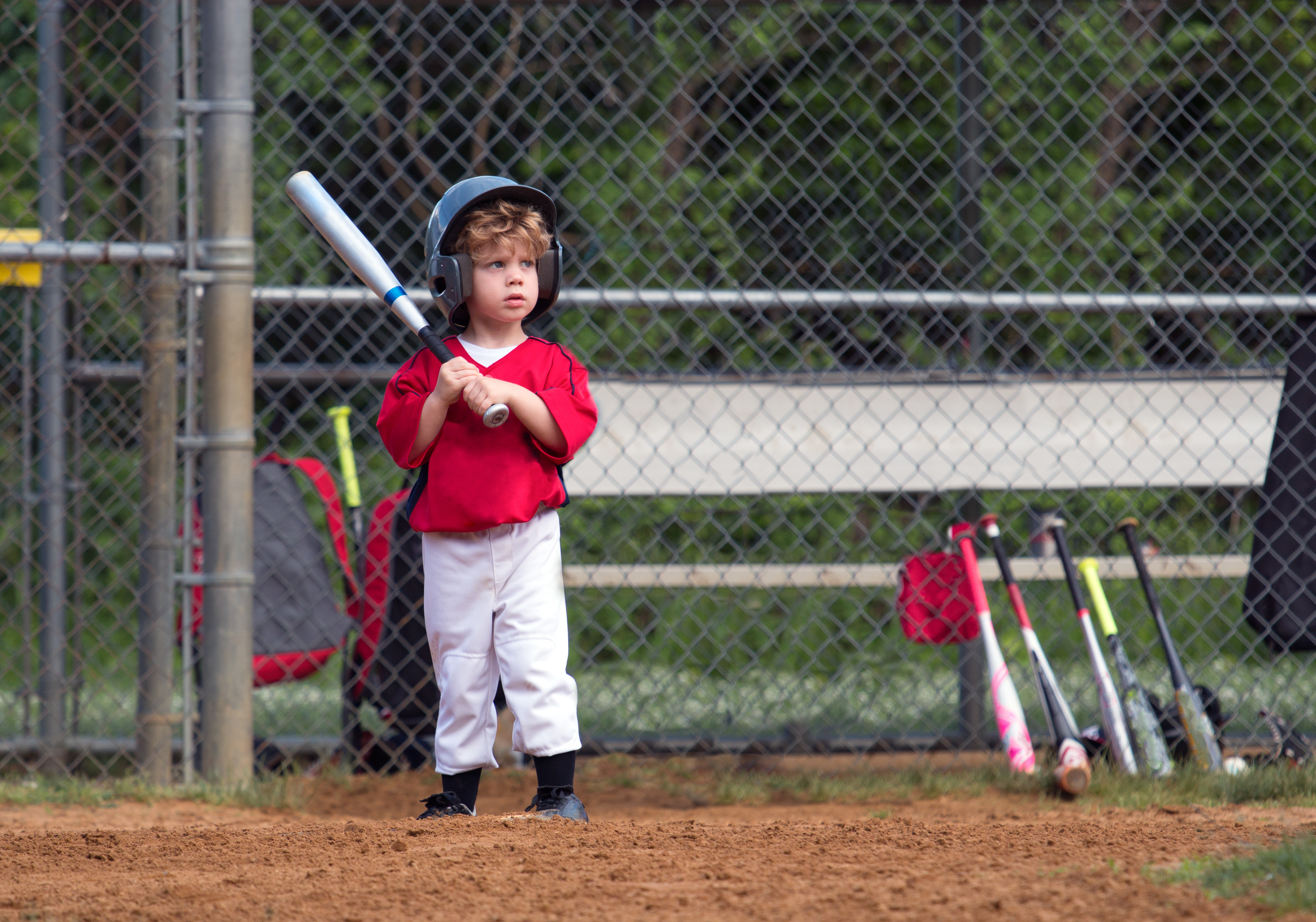 adobe toddler in little league with bat