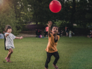 Is Less Play Time Leading to Less Reading? unsplash children playing with big red ball
