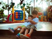 kids playing on merry go round Photo by Hisu lee on Unsplash