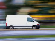 white van with colorful background