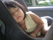 girl asleep carseat royalty free