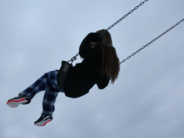 unsplash kid on swing in air noah sillman