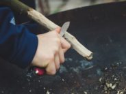 Where Can You Find Other Parents who Want to Give Their 5-Year-Olds a Knife? kid hand with knife whittle markus-spiske-AAtPYCeUk0Q-unsplash