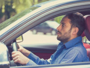 The Top 10 Parent-Judging/Safety-Panic Moments of 2021 scared funny looking young man driver in the car. Human emotion face expression. Side window view of inexperienced anxious motorist