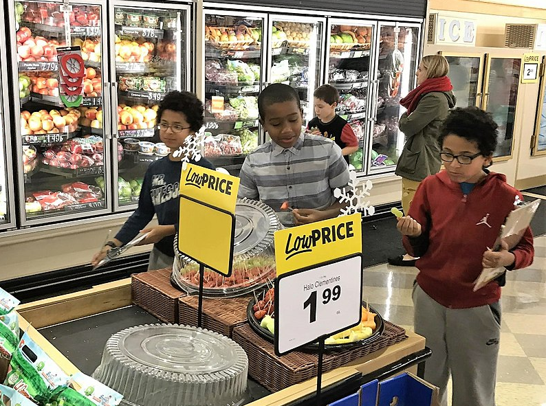 At the grocery store, Mr. Arnett allowed each of his children to fill their  own bag with trail mix for 